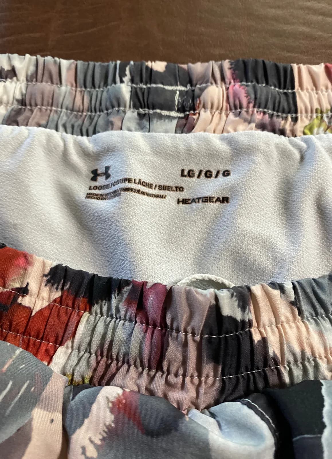 Multicolor Under Armour heat gear running shorts
